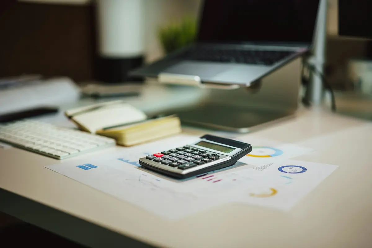 Calculator on a study desk for IB grade boundary planning