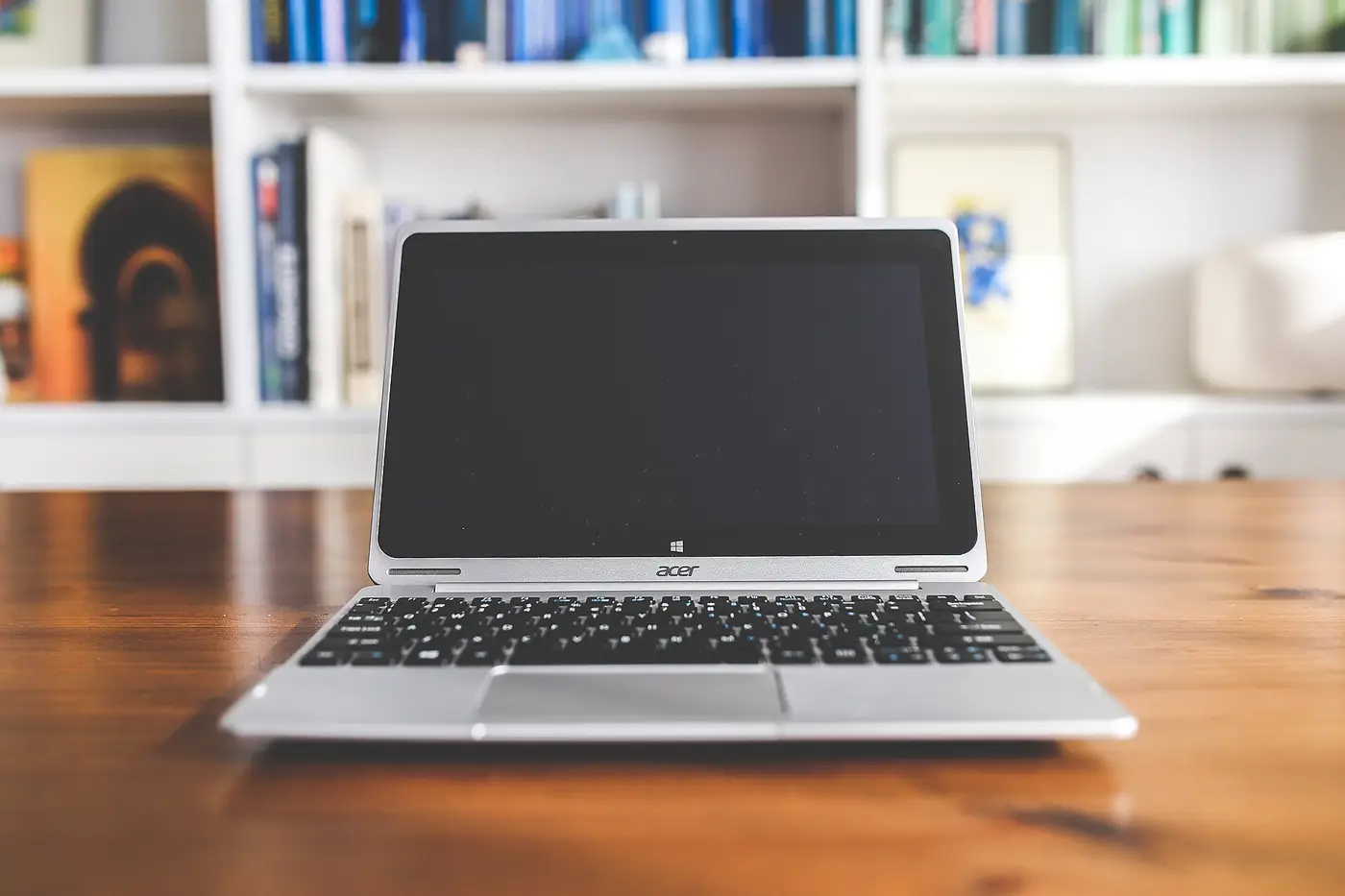 Laptop and notebook prepared for an IB retake registration checklist