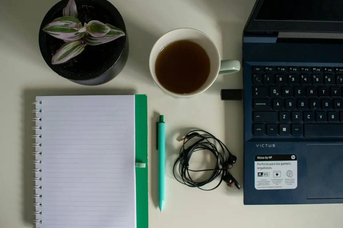 Notebook, laptop and study desk for TOK and Extended Essay planning
